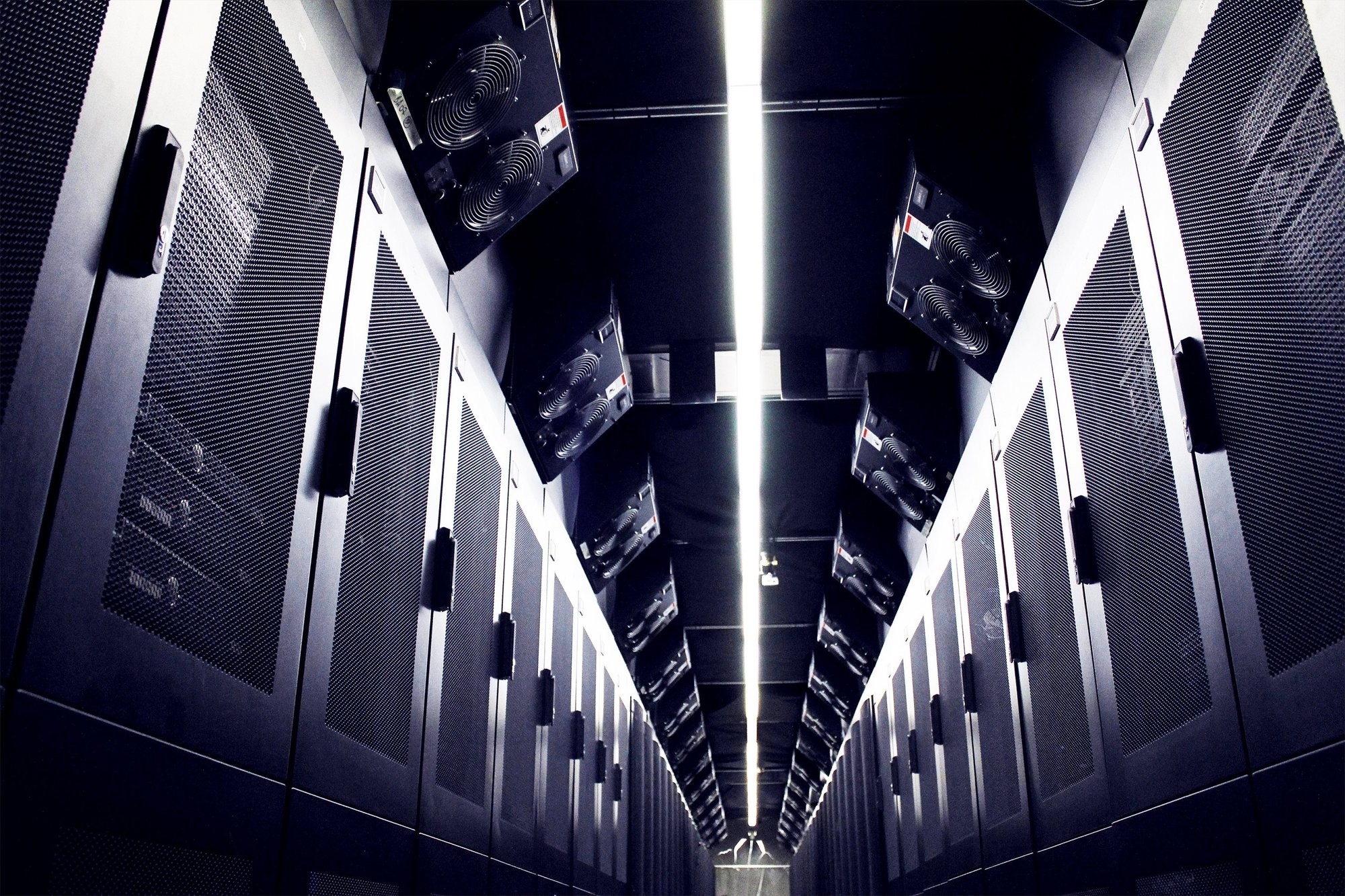 A row of black server racks like those found in MTL-1, the eStruxture downtown Montreal carrier hotel and high density data center at SS160-800 Square-Victoria.
